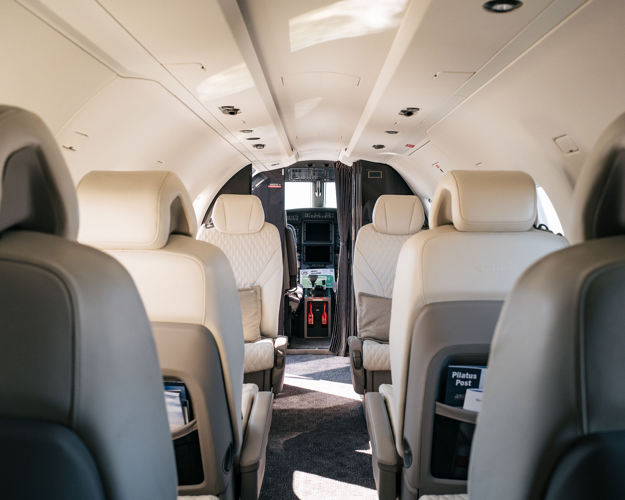 The main cabin of the Falcon 2000LX through the forward galley toward the cockpit