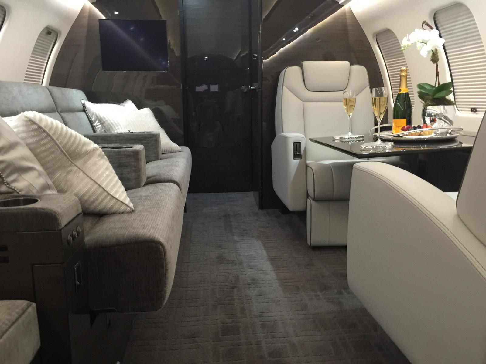 The main cabin of the Falcon 2000LX through the forward galley toward the cockpit