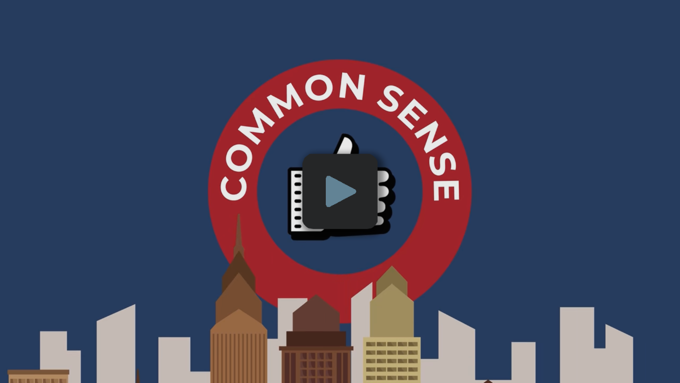 Illustration of a city skyline with a red circle above containing the text 'COMMON SENSE' and a thumbs-up icon in the center.