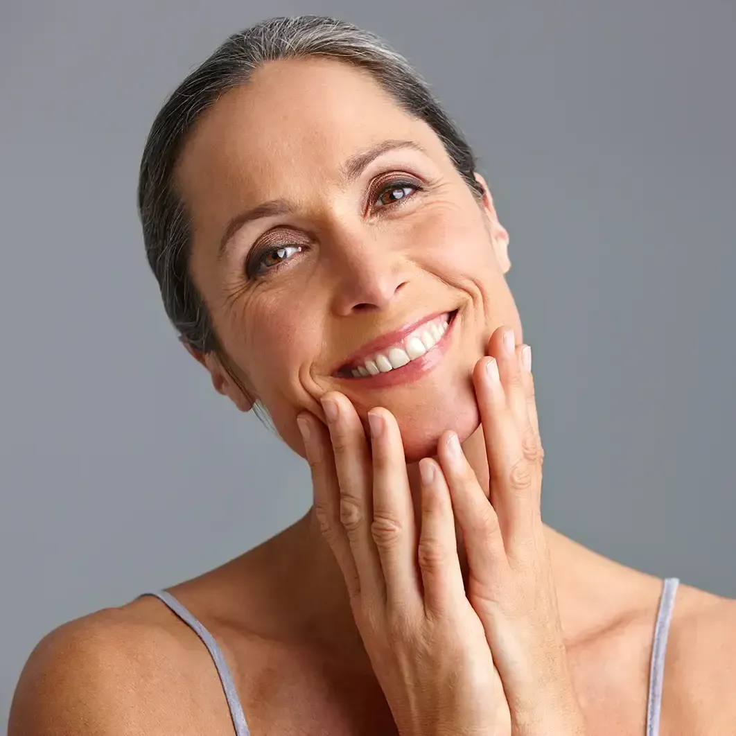 A woman with grey hair smiling
