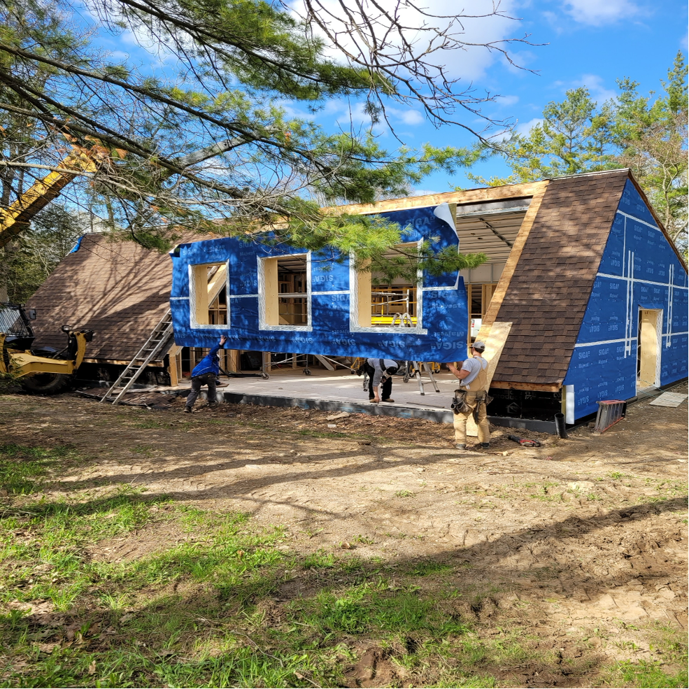 Roof has been cutaway and new wall and roof system is being installed