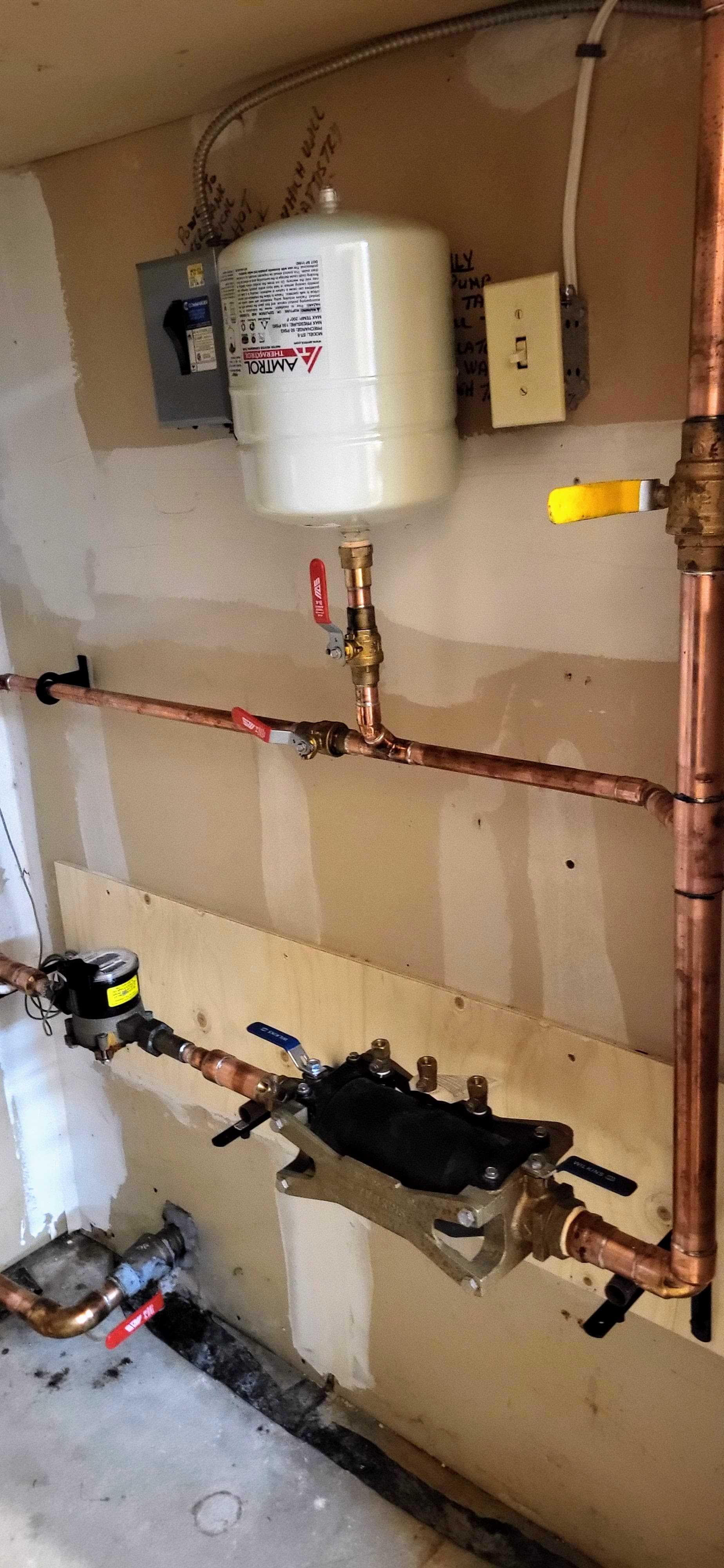 A pipes and valves on a wallAI-generated content may be incorrect.