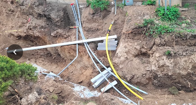 A close-up of pipes in the groundAI-generated content may be incorrect.