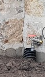 A pipe next to a wallAI-generated content may be incorrect.