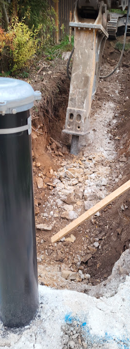 A hole in the ground with a pipeAI-generated content may be incorrect.