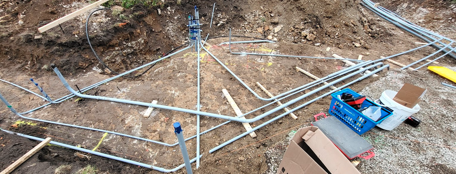 A close-up of pipes in the groundAI-generated content may be incorrect.