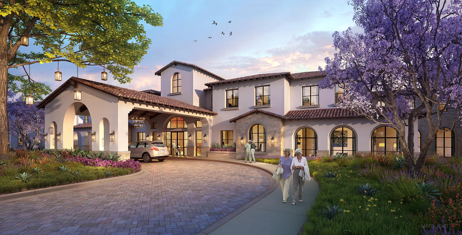 A modern, elegant building with arched windows and a terracotta roof at sunset. A car is parked near the entrance, and three elderly people walk nearby.