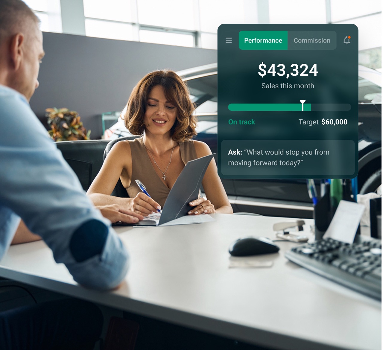 A sales rep helping a client in a dealership.