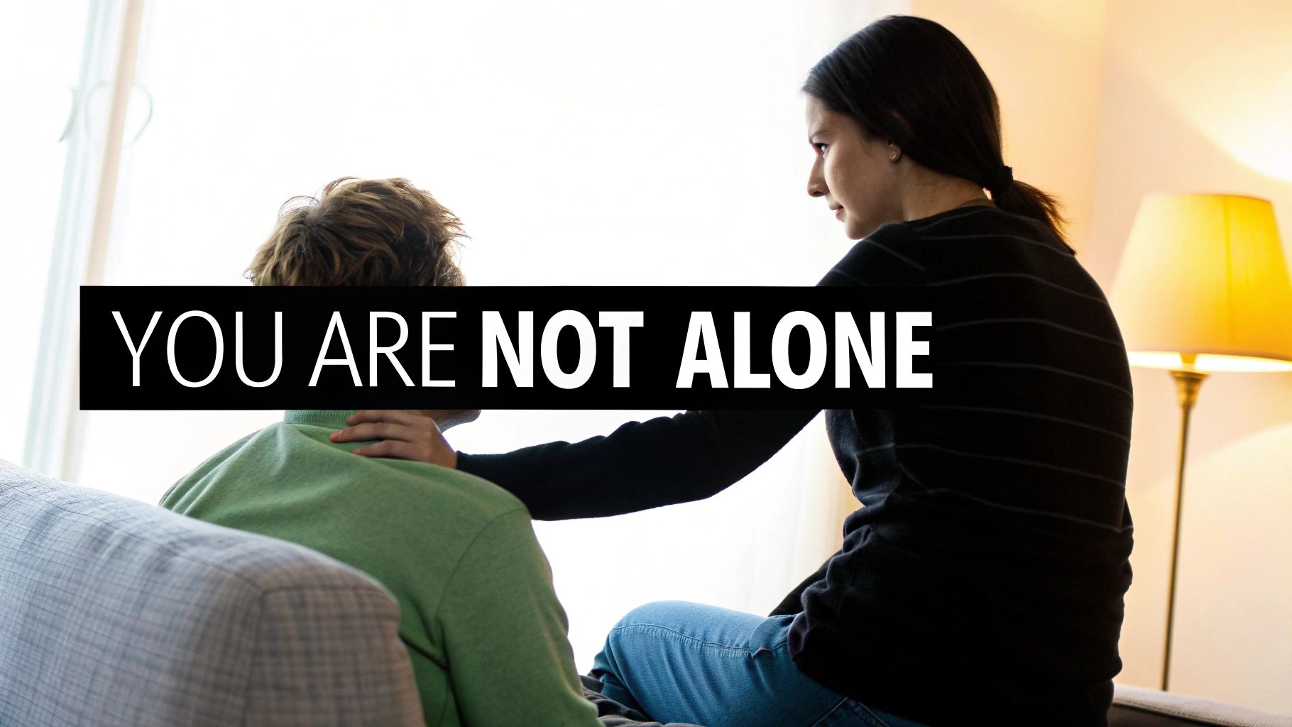 A diverse group of friends offers comfort and support to a woman, symbolizing the importance of a strong social network during chemotherapy.