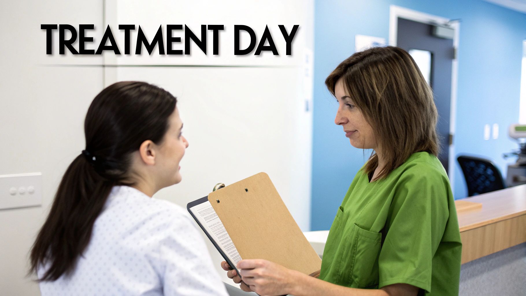 A medical professional compassionately speaks with a patient in a treatment room.