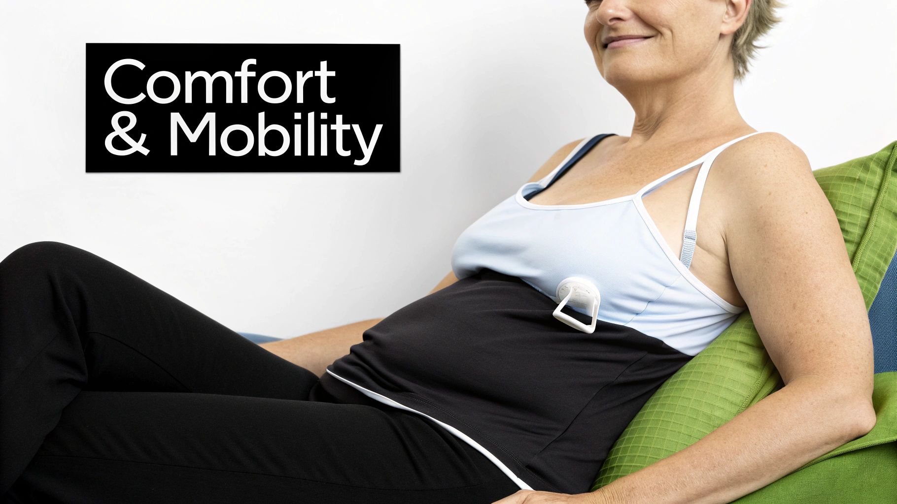 Smiling woman resting comfortably with a medical drain attached, promoting comfort and mobility.