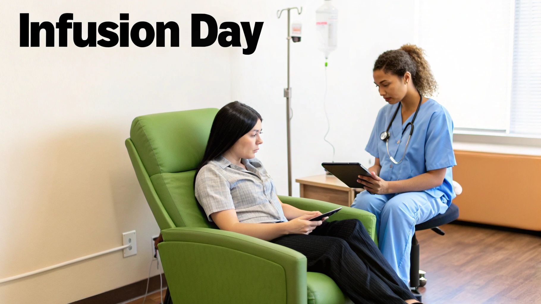 A nurse consults with a patient in a recliner during an infusion session.