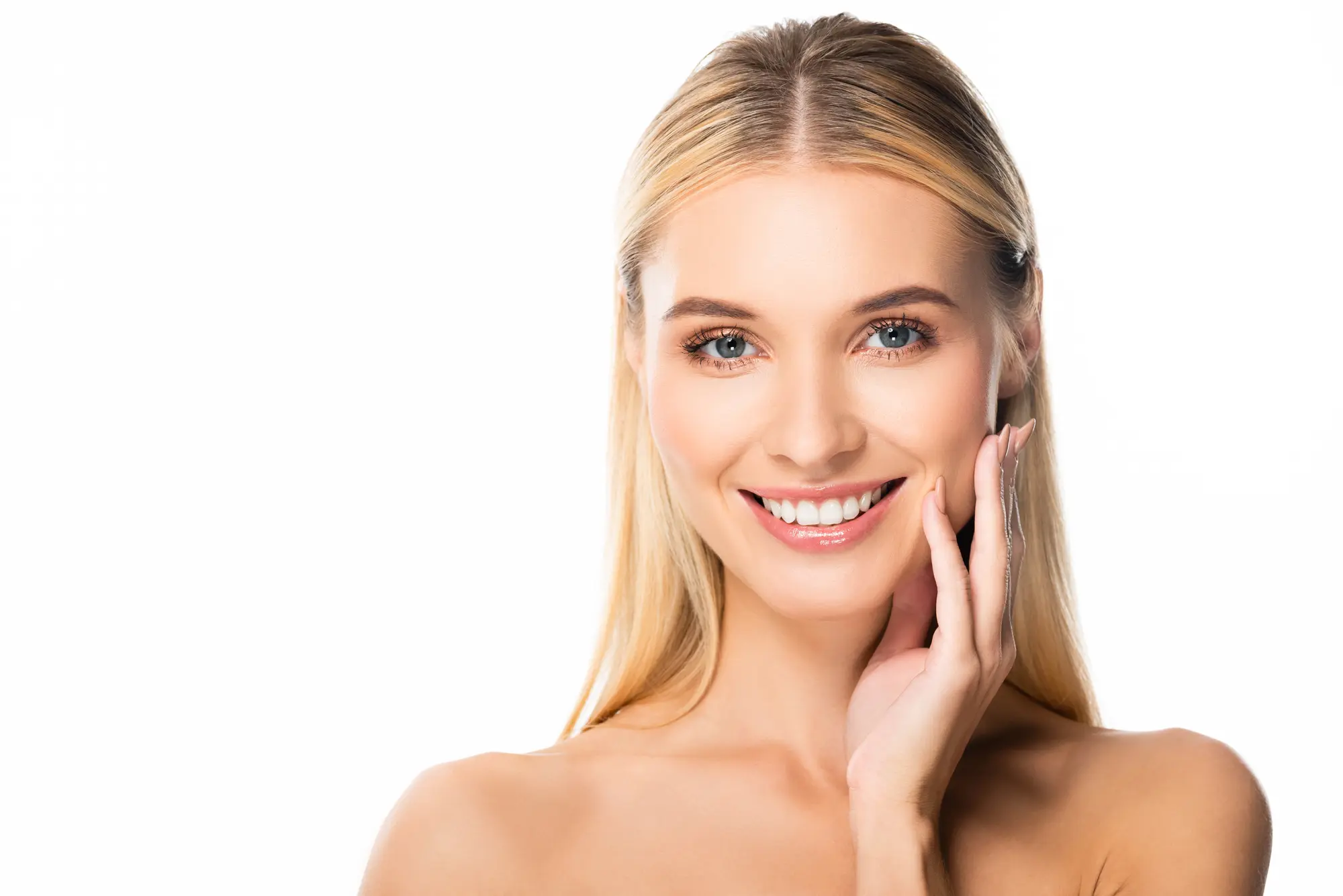 woman smiling with hand on her face