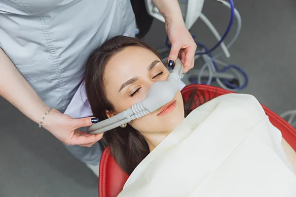 woman undergoing nitrous oxide sedation