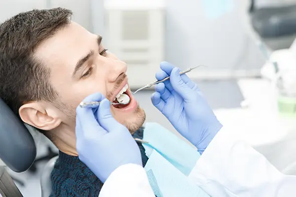 patient getting teeth checked