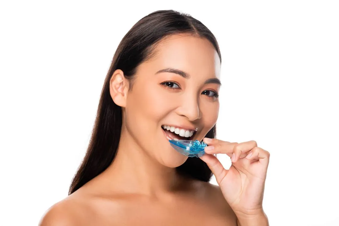 person putting in mouthguard