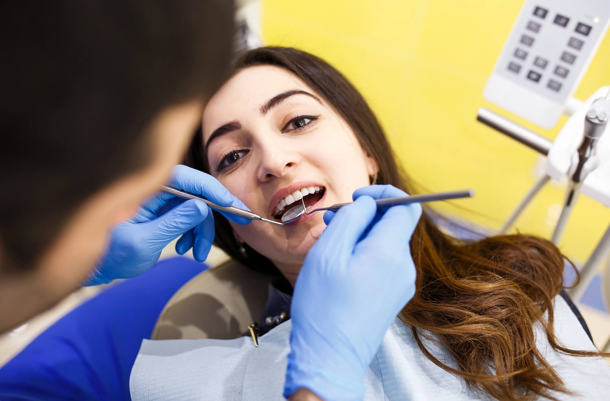 dentist assessing same day dental crowns hampton va