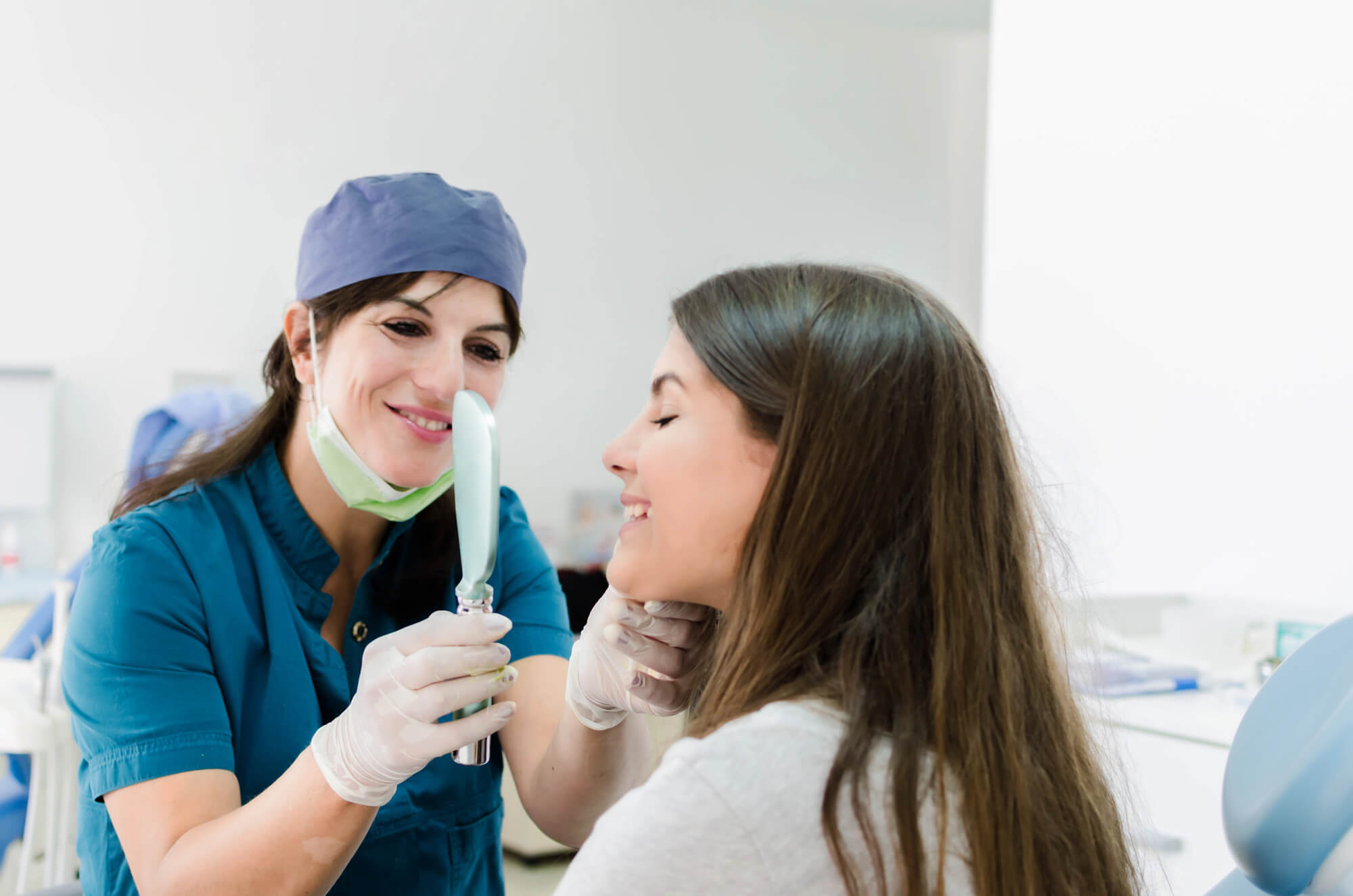 dentist assessing full mouth restoration chesapeake