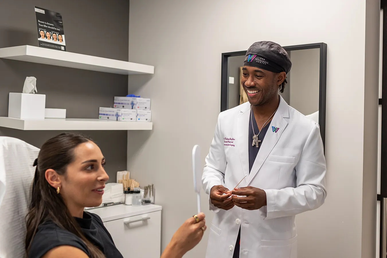 Dr. Keimun Slaugther and young woman patient admiring Botox treatment results. 