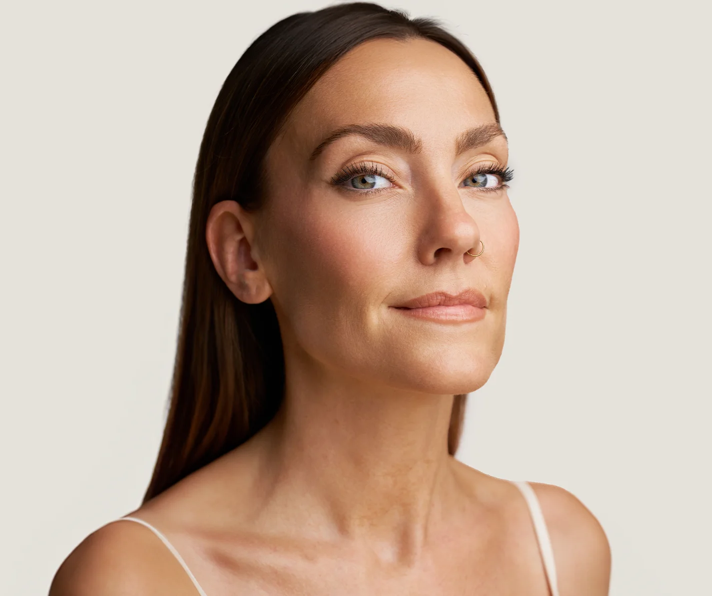 Young woman with smooth skin, free of wrinkles or fine lines. 