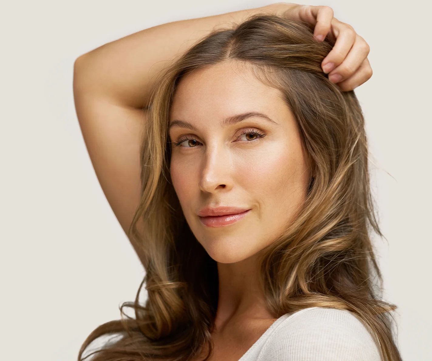 Young woman with radiant, refreshed skin and defined lip contour. 