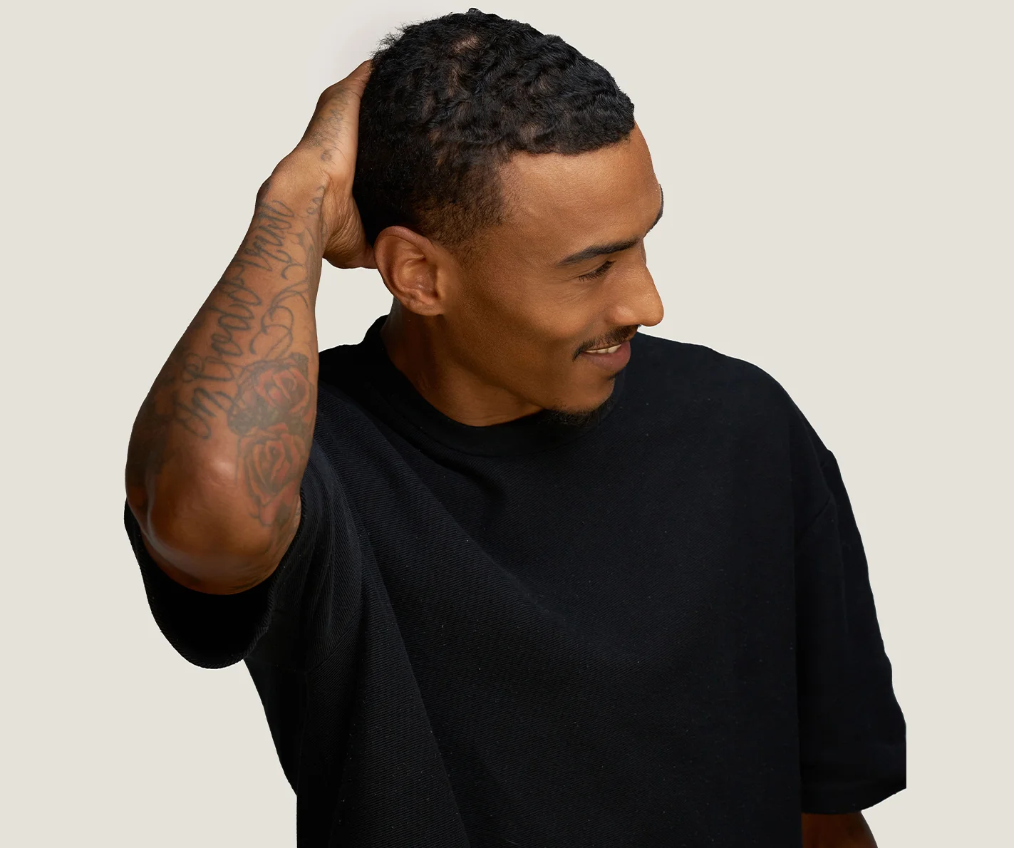 Young man with defined facial contour and a sharp jawline. 