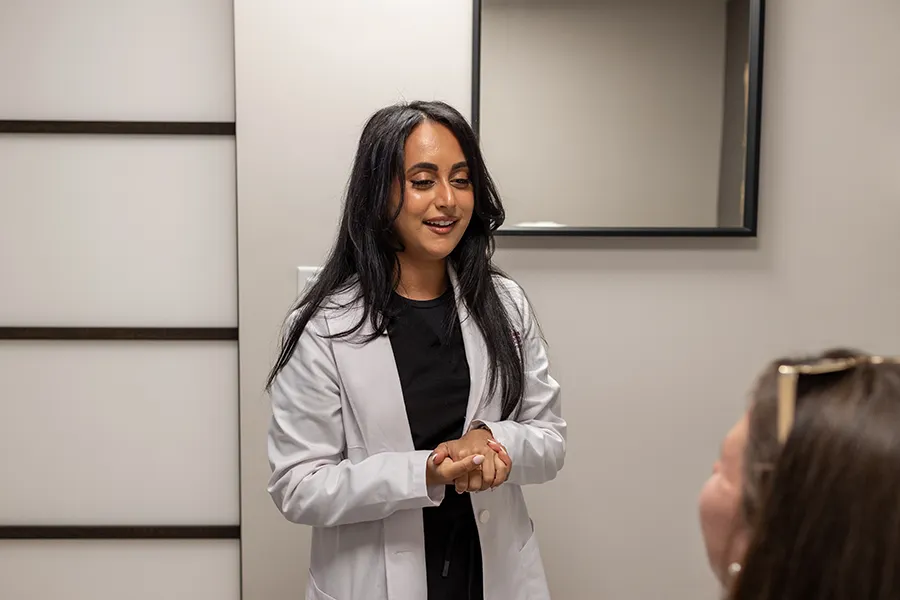 PA Seema Teymouri having a consulation with a woman patient.