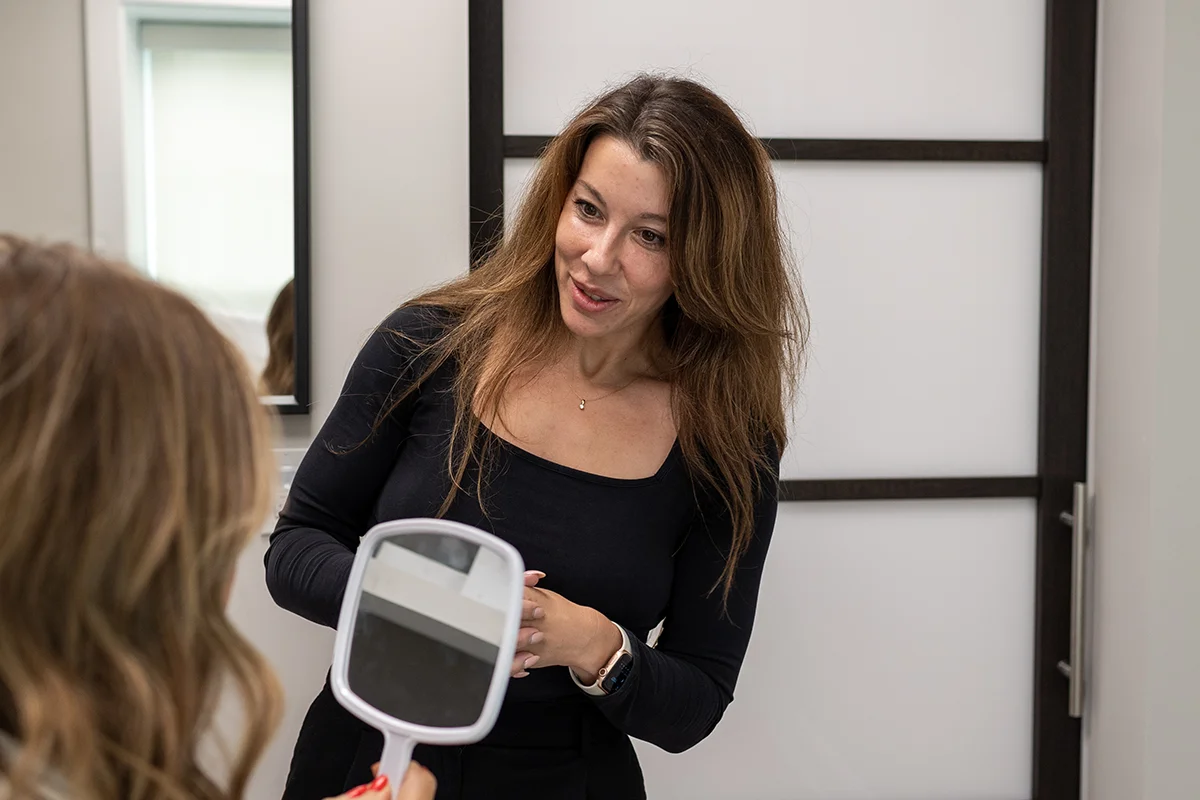 Young woman receiving a consultation from provider Shannon Ballow. 