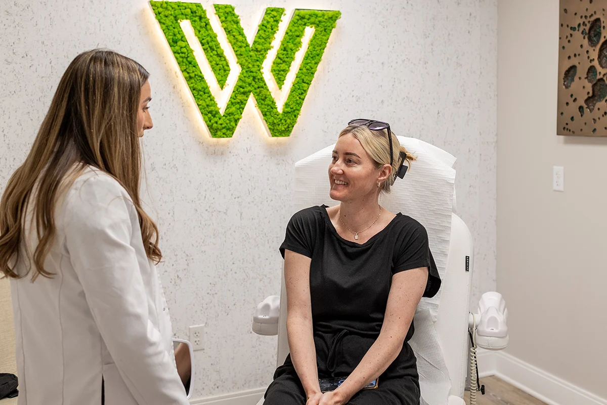 Middle-aged woman receiving a consultation from provider Ingrid Krong. 