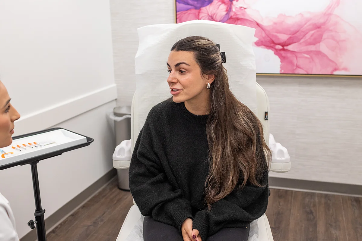 Young woman receiving a consultation from provider Ingrid Krong.