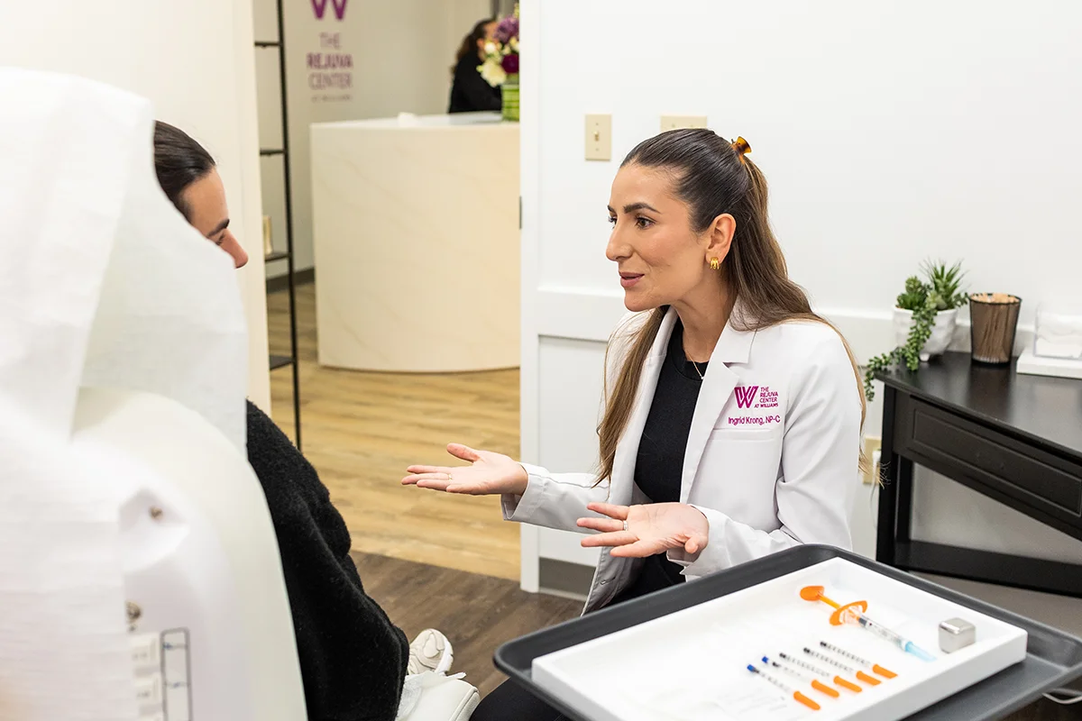 Young woman receiving a consultation from provider Ingrid Krong. 