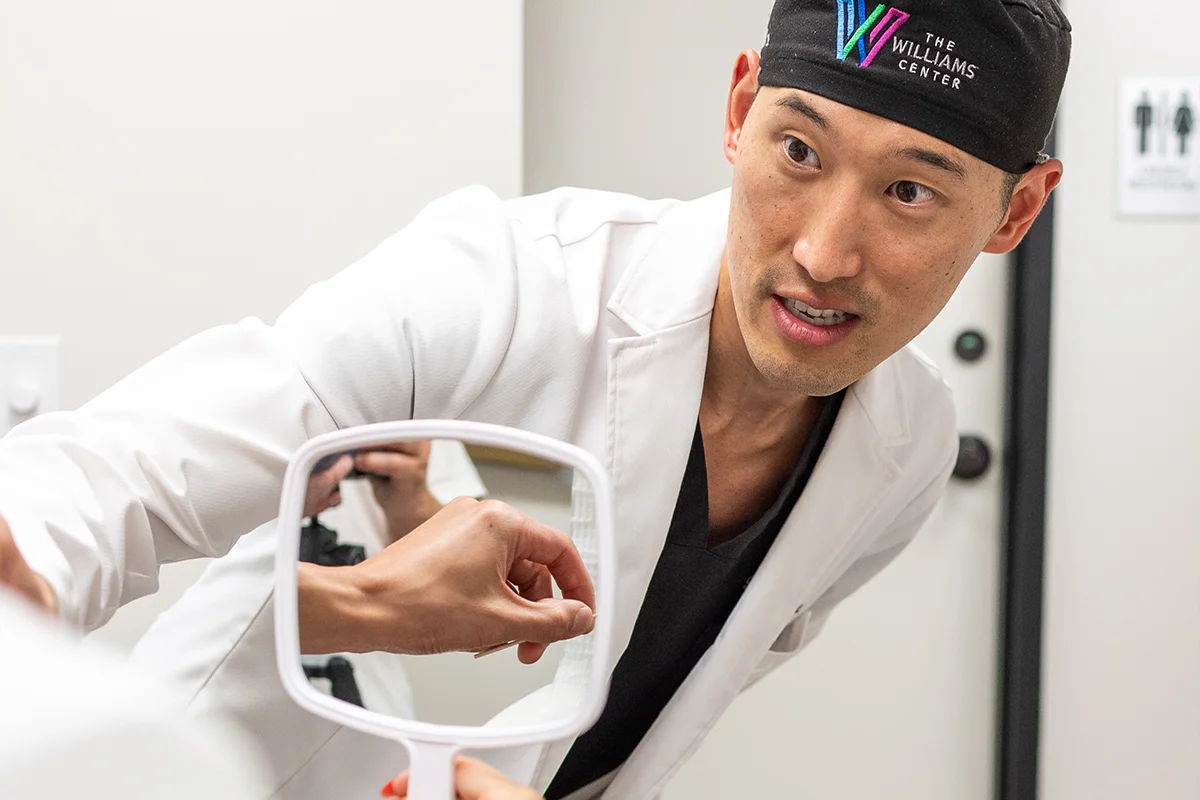 Dr. Daniel Lee having a consultation with a patient.