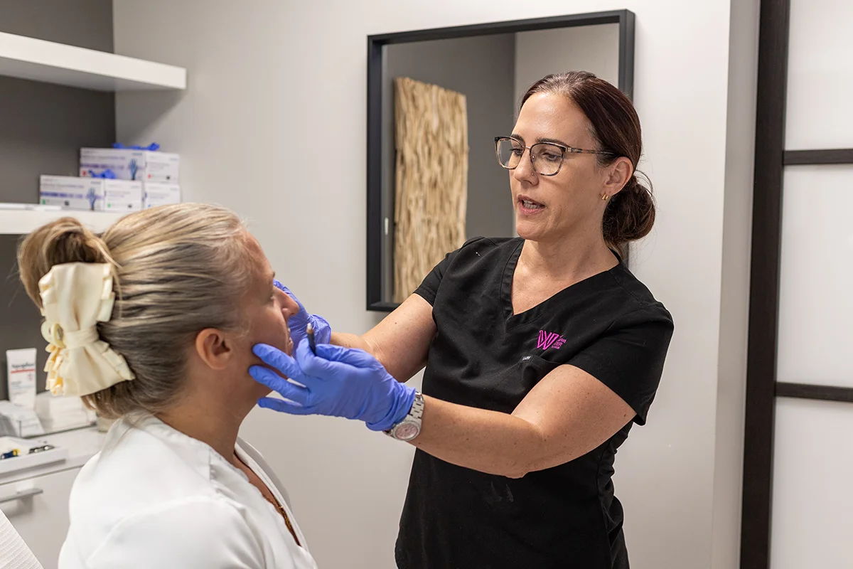 Middle-aged woman receiving a consultation from provider Lisa LeBlanc. 