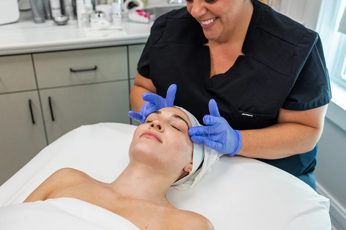 Young woman receiving a custom facial. 