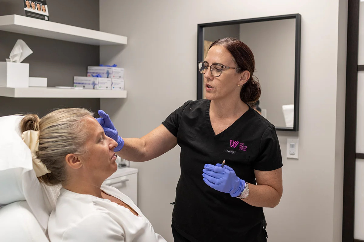 Older woman receiving a consultation from provider Lisa LeBlanc. 