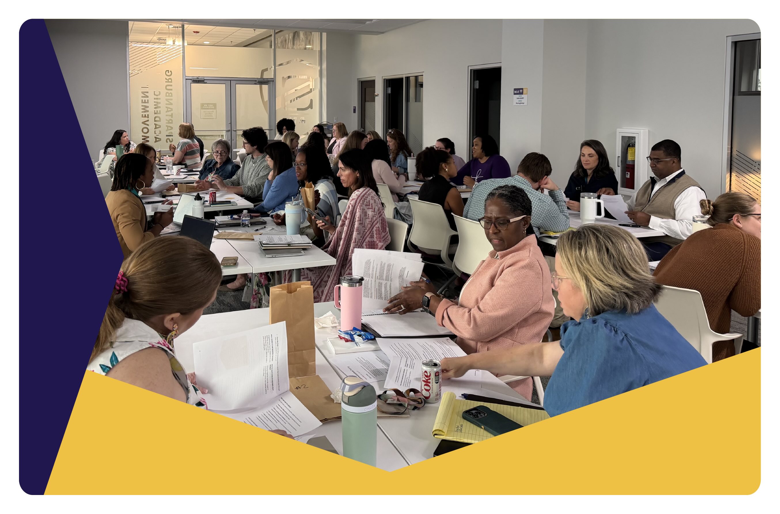 A photo of a room of people participating in programs of Spartanburg Academic Movement, a brand client of social impact consultant Friday.