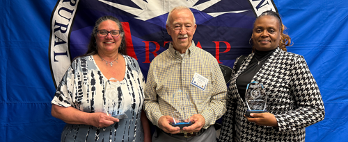2025 Bus Division Winners, three people
