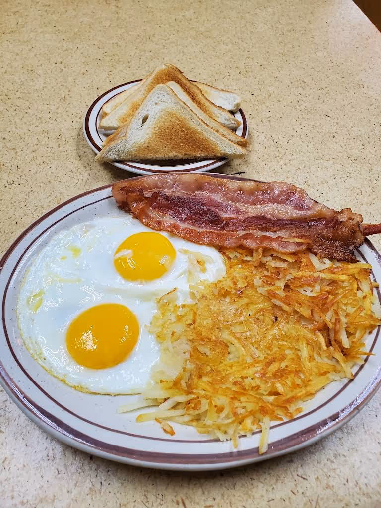 Plate with bacon, rice, and eggs