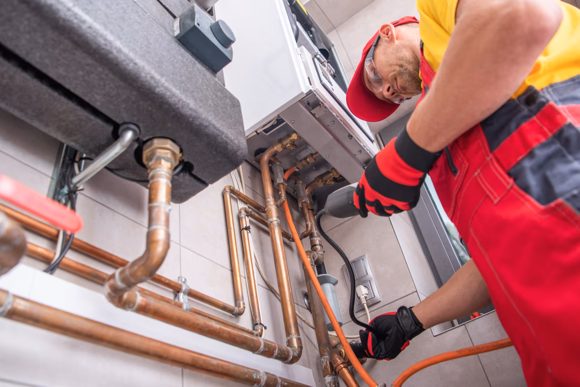 Seattle plumber installing a tankless water heater.