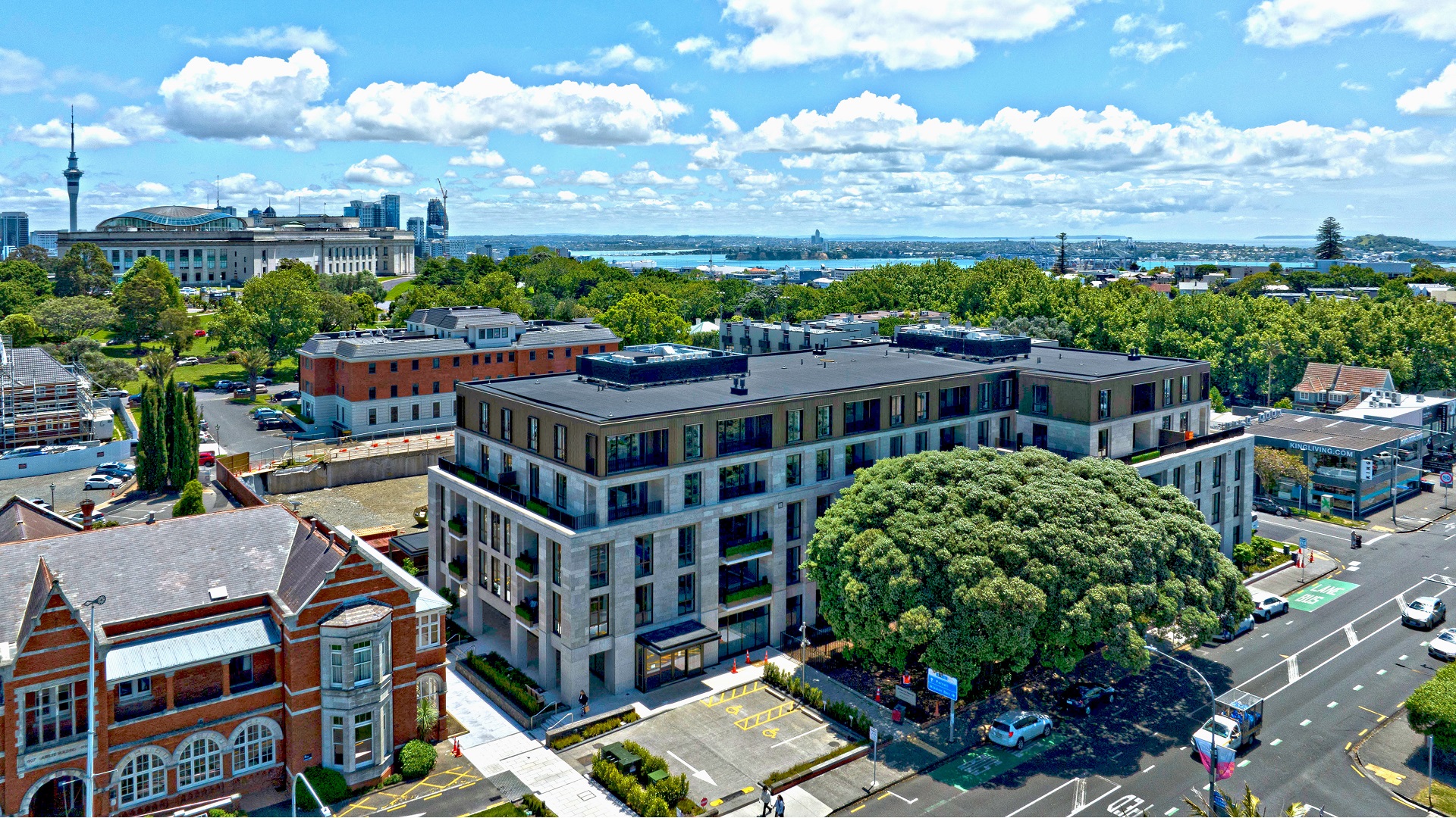 Aerial view of The Foundation Private Residences in Auckland with surrounding city skyline and harbour.