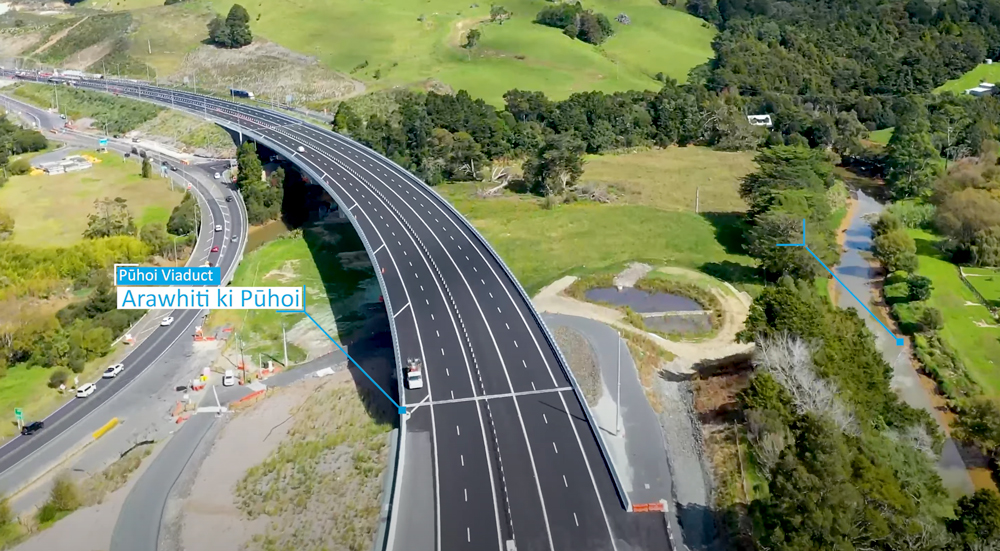 The Arawhiti ki Pūhoi Viaduct carrying the Ara Tūhono motorway across the valley at Pūhoi, showing extensive civil and concrete infrastructure work amid rural landscapes.