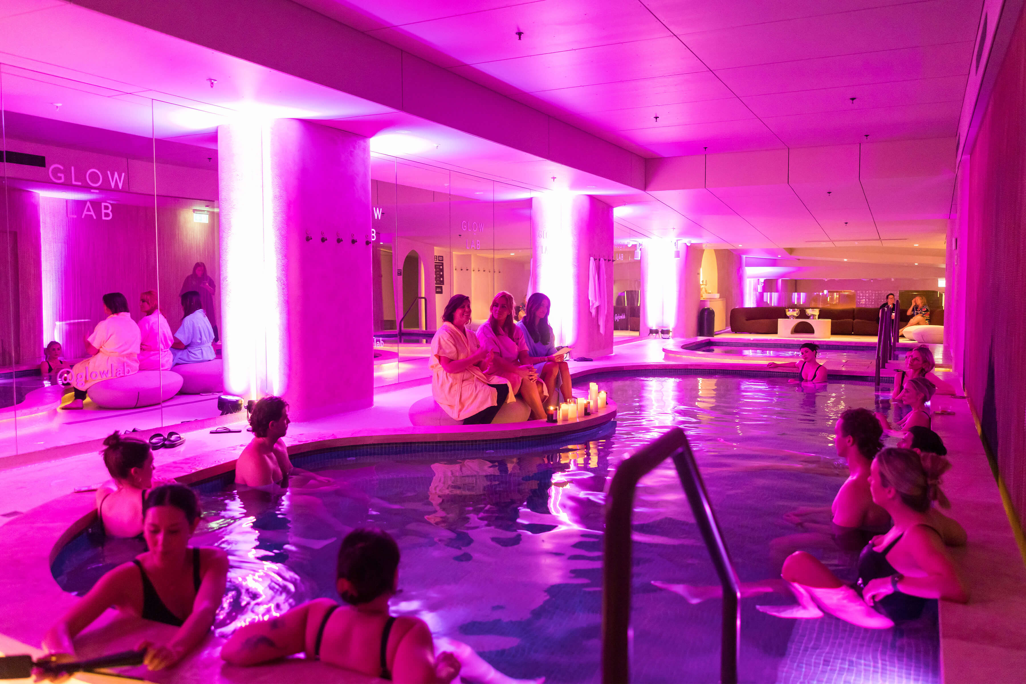 F1 Driver, Valtteri Bottas wearing a turquoise Uber Carshare outfit, standing in front of a branded car in suburban Australia for the Uber Carshare campaign.