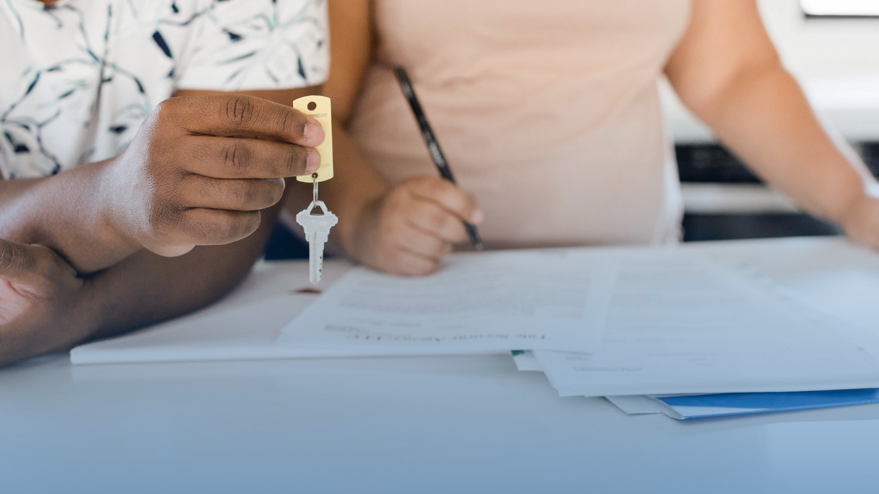 A person holding a key and penAI-generated content may be incorrect.