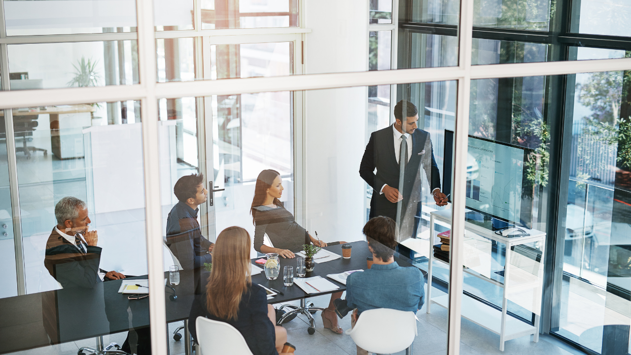 A person standing in front of a group of peopleAI-generated content may be incorrect.