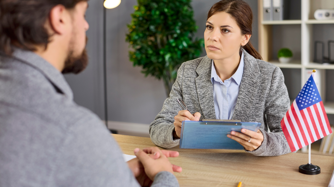 immigration officer interviewing an applicant