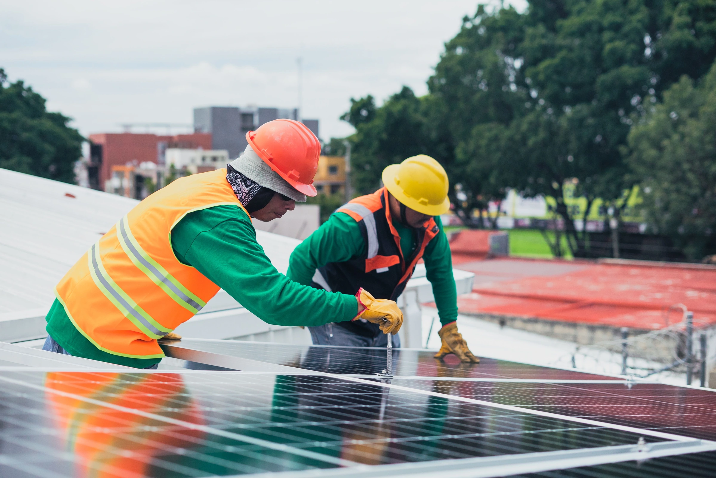 Engineers installing rooftop solar panels