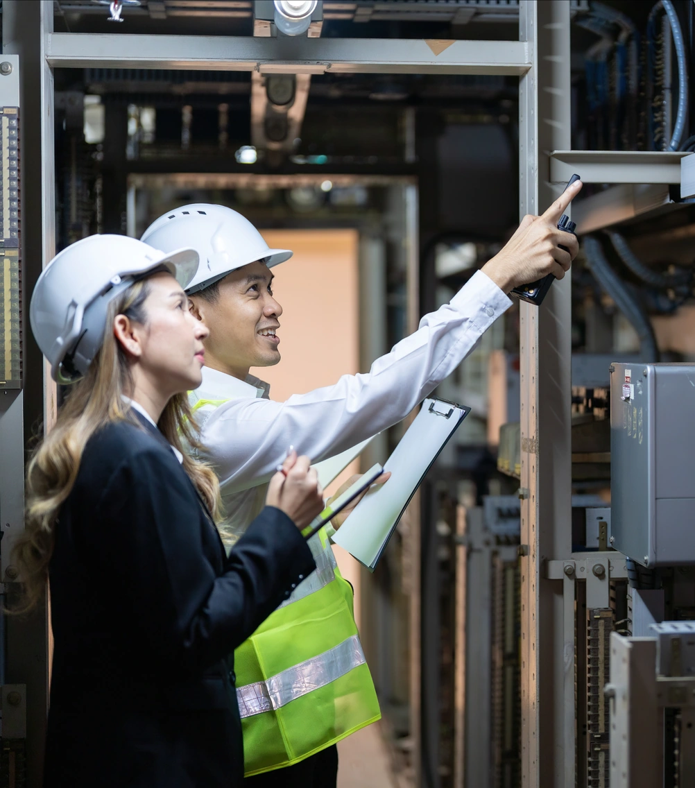 Energy specialists inspecting electrical equipment