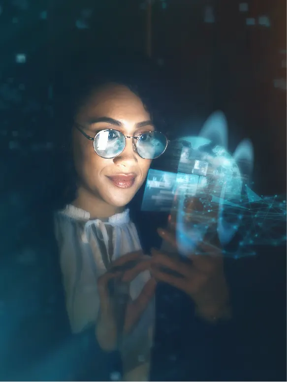 Woman wearing glasses interacting with a floating digital interface with holographic data and network visuals.