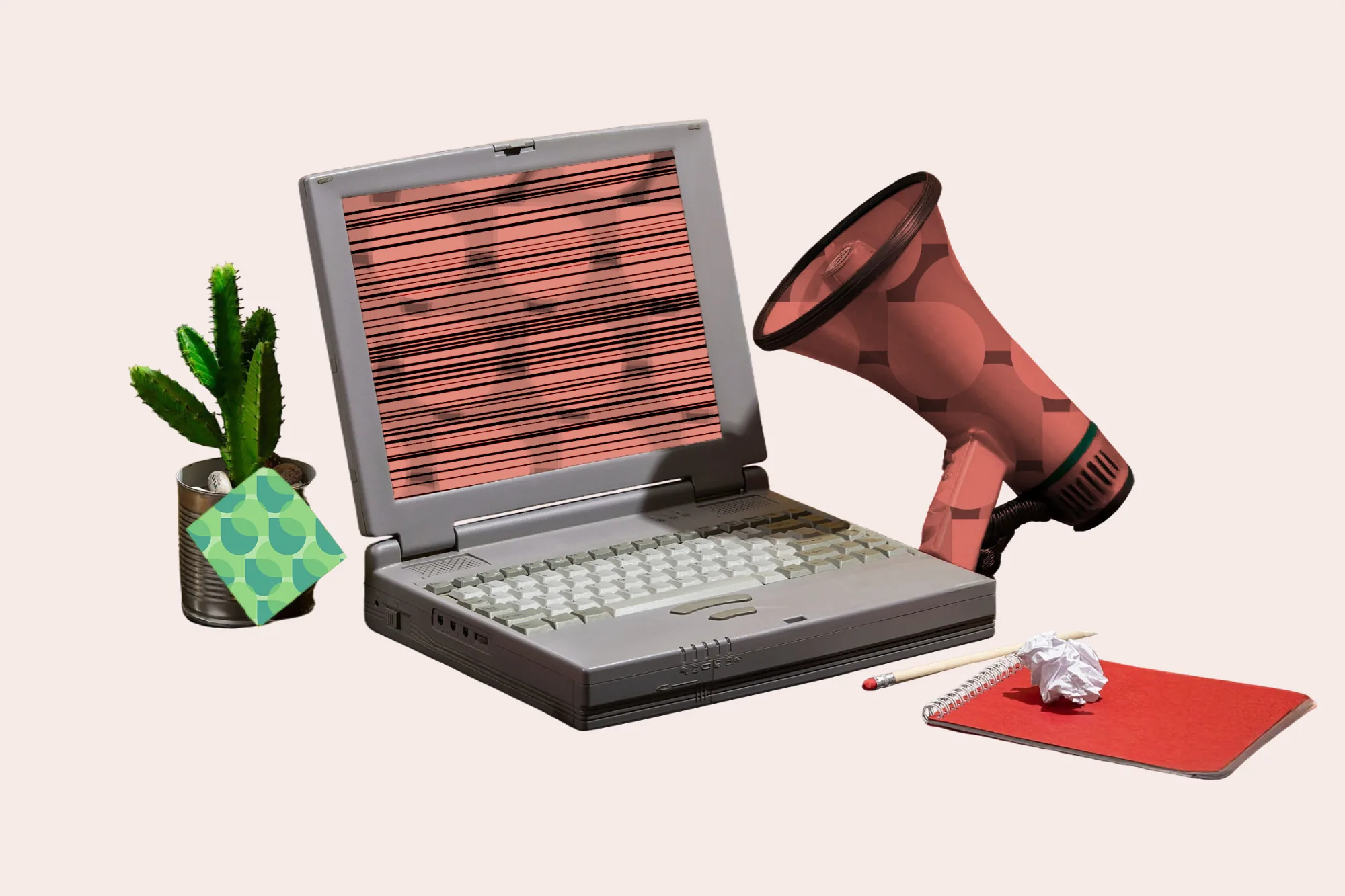 Collage of a vintage laptop with a megaphone, symbolizing online advertising.