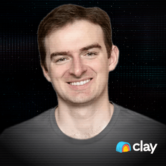 Smiling young man with short brown hair wearing a gray shirt against a dark background with colorful dots, Clay logo in the bottom right corner.
